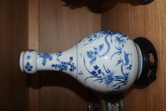 A Chinese Kangxi blue and white bottle vase, on hardwood stand vase excluding stand 23cm